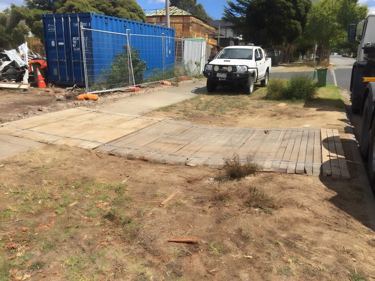 Wooden crossover protecting footpath at Melbourne construction site.