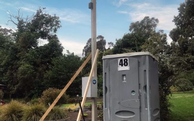 Power pole and portable toilet